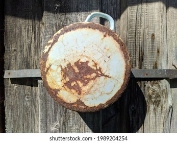 Rusty And Old Saucepan On Wooden Background