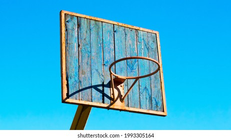 Rusty Old School Basketball Board And Blue Sunny Sky