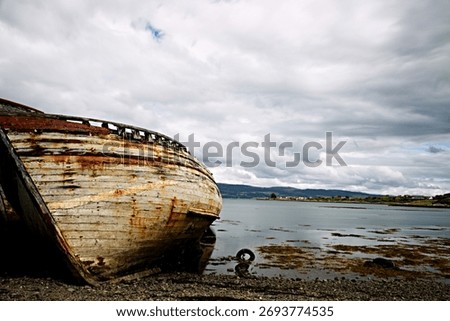 A rusty old ship on the Mull Coast of Lock Lake in Scotland