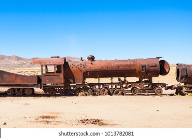 Rusty old steam train at the Train Cemetery, Salar de Uyuni, Bolivia - Shutterstock ID 1013782081