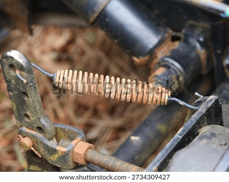 Rusty old tension spring as a component in a truck