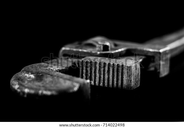 Rusty, old workshop keys. Hydraulic keys on a
black table in a
workshop.