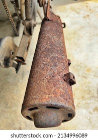 Rusty on the exhaust pipe of a motorcycle, selective focus.