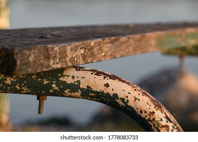 Rusty Picnic Bench Near A Lake