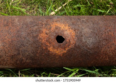 Rusty Pipe With The Hole.