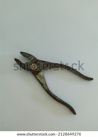 rusty pliers on a white background