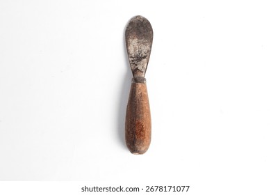 Rusty putty knife carpentry tool isolated on white background