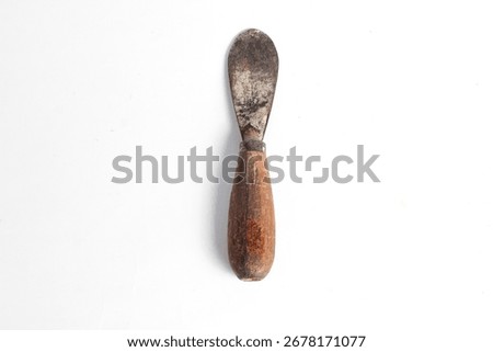 Rusty putty knife carpentry tool isolated on white background