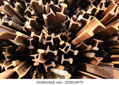 Rusty rail (extracted railway)is the scrap iron which can be  shortening with gas and reused as raw material for electric arc furnace (EAF)  - Shutterstock ID 2233116973