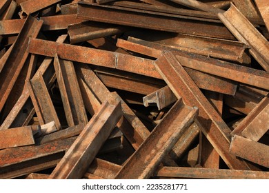 Rusty rail (extracted railway)is the scrap iron which can be  shortening with gas and reused as raw material for electric arc furnace (EAF)  - Shutterstock ID 2235281771