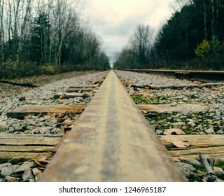 Rusty Railroad Track Into Distance.Central Michigan In Fall.
