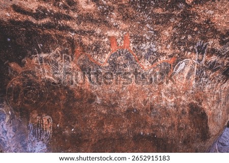 Rusty Red Cave Formations with Aboriginal Rock Art near Uluru, Australia
