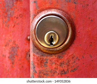 Rusty Red Door Key Hole