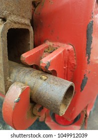 Rusty Red Tailgate Latch On A Dump Truck