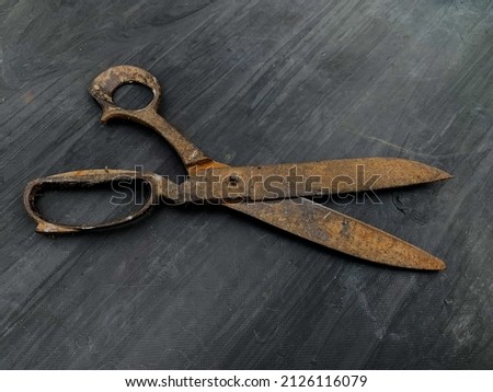 rusty scissors are left on the table