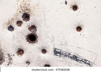 rusty and scratched metal panel background with bullet holes - Powered by Shutterstock