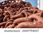 Rusty ship chain, reddish color, Canido port, close-up
