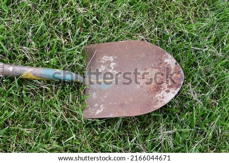 Rusty shovel in a yard