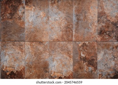 Rusty slate stone tiled wall texture or background