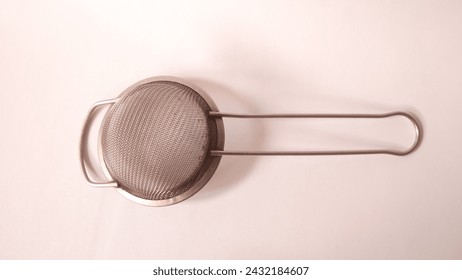 Rusty small silver metal strainer tea kitchen strainer isolated on white background