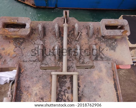 Rusty sockets for twistlocks on container vessel, sockets for container lashing