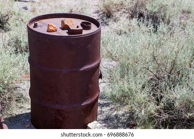 Rusty Steel 55 Gallon Drum Among Sagebrush