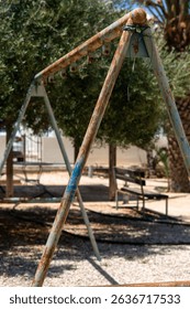 Rusty swingset at sunny park