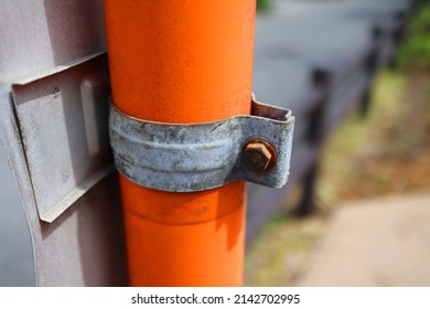 Rusty Threaded Part Of A Pole On A Curved Mirror