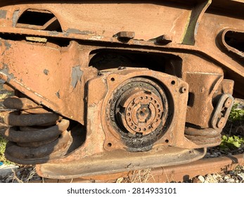 Rusty train bogie wheel axle and spring industrial detail
Detailed close up of rusty train bogie with wheel axle and spring. Old industrial metal mechanism texture.