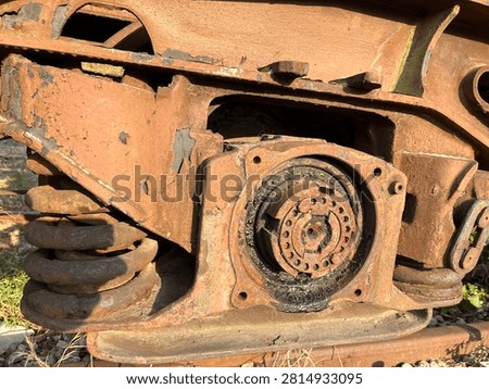Rusty train bogie wheel axle and spring industrial detail
Detailed close up of rusty train bogie with wheel axle and spring. Old industrial metal mechanism texture.