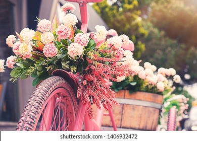 Rusty tricycle bike with flower pot in tray against blured background - Powered by Shutterstock