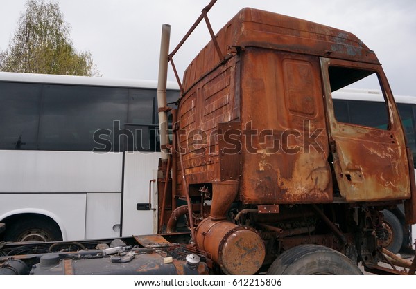 Rusty truck -\
a tractor after a fire and\
accident