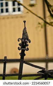 A Rusty Vertical Member Of An Old Metal Fence