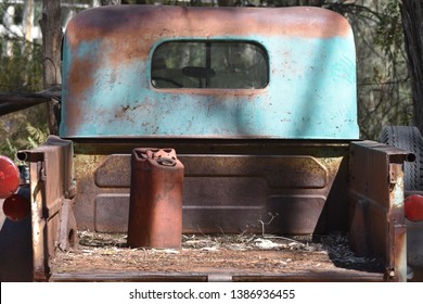 Rusty Vintage Truck With Old Gas Can