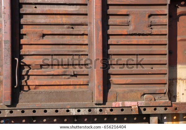 Rusty wall of the freight\
railway car