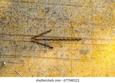 the rusty wall to the left arrow