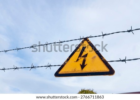 Rusty warning symbol for high voltage power. The Concept of risk.