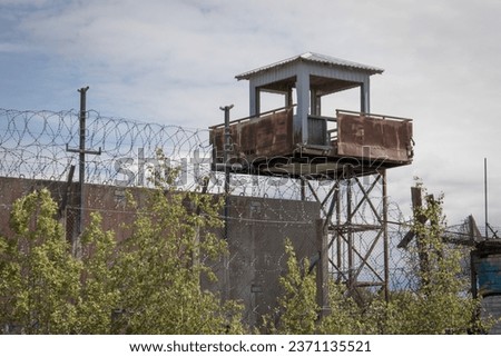 Rusty watch tower with barbwire on a former prison in Rummu, Estonia