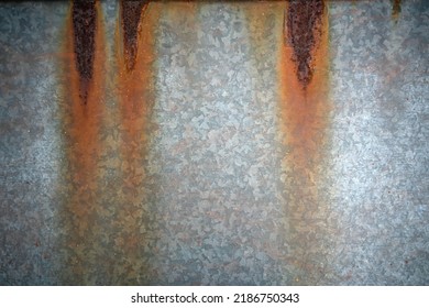 Rusty Water Stains On The Metal.Metal Corrosion, A Clean Place For Text.Iron Background With Rust.