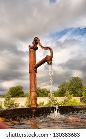 Rusty Water Tap In Sunset Light Against Dramatic Skies. Shot In Franshoek, Western Cape, South Africa.