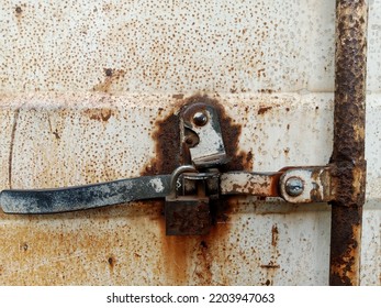 Rusty White Metal Plate Door With Padlock