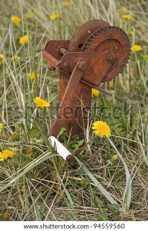 Rusty winch, used to pull up small boats from the beach