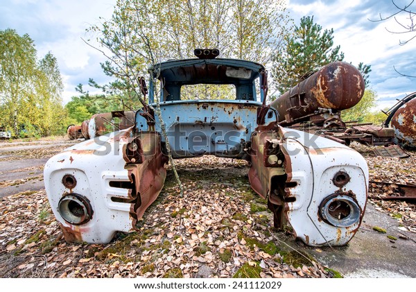 rusty wreck on junk\
yard near Illinci village in Chernobyl Nuclear Power Plant Zone of\
Alienation, Ukraine