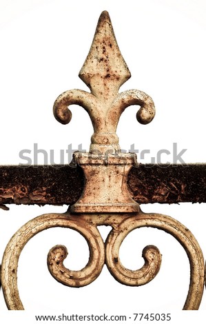 Rusty wrought iron fleur de lis isolated against white background.
