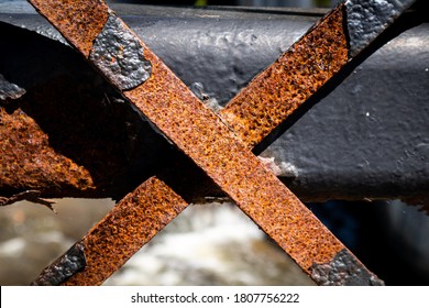 Rusty X Shaped Metal Fence Bars