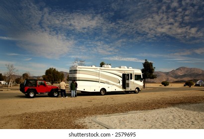 RV Coach Towing An Offroad 4X4 Vehicle