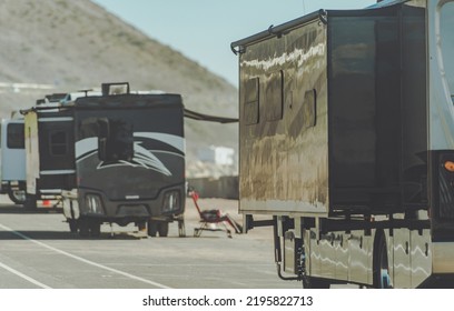 RV Motorhomes Camping Next to California Pacific Shoreline. Motorcoaches with Extended Slide Outs. Recreational Vehicles Theme. - Shutterstock ID 2195822713