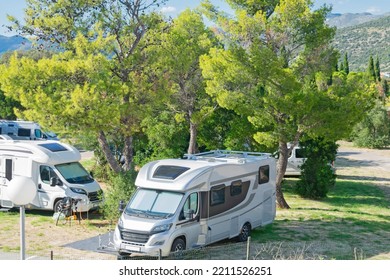 RV Park Camping. Mountain Campsite. Vacation In Recreational Vehicle. 