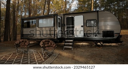 RV in a shady spot in a forest duting the day in North Carolina