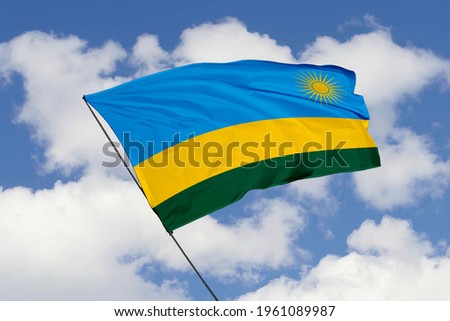 Rwanda flag isolated on sky background with clipping path. close up waving flag of Rwanda. flag symbols of Rwanda.